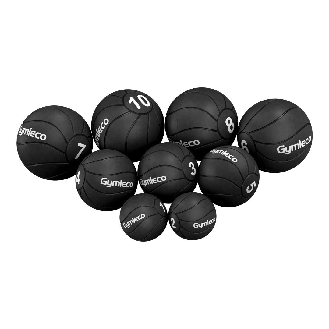 Set of black Gymleco medicine balls on a white background