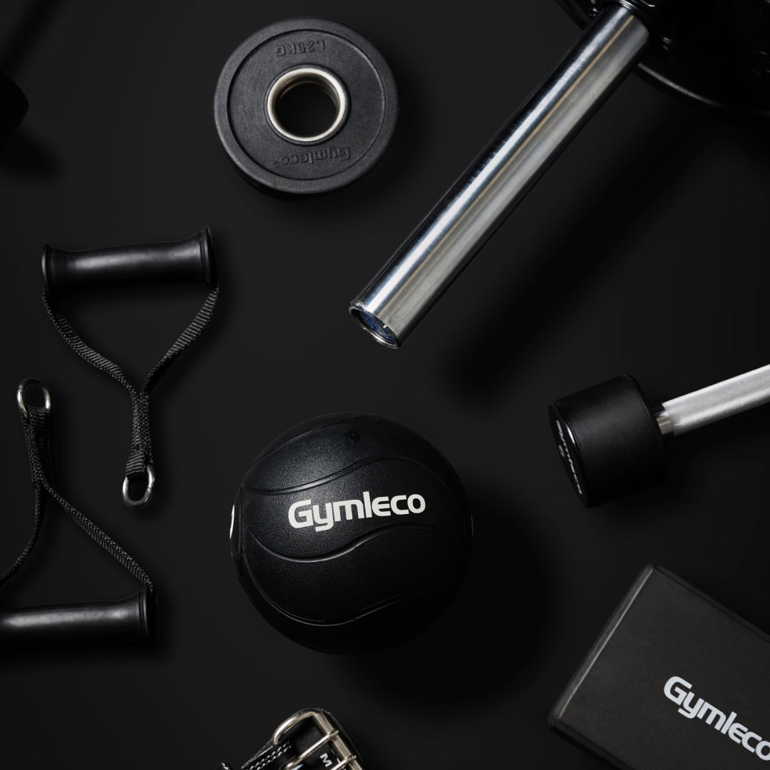 Gym equipment including weights and resistance bands on a black background with 'Gymleco' branding.
