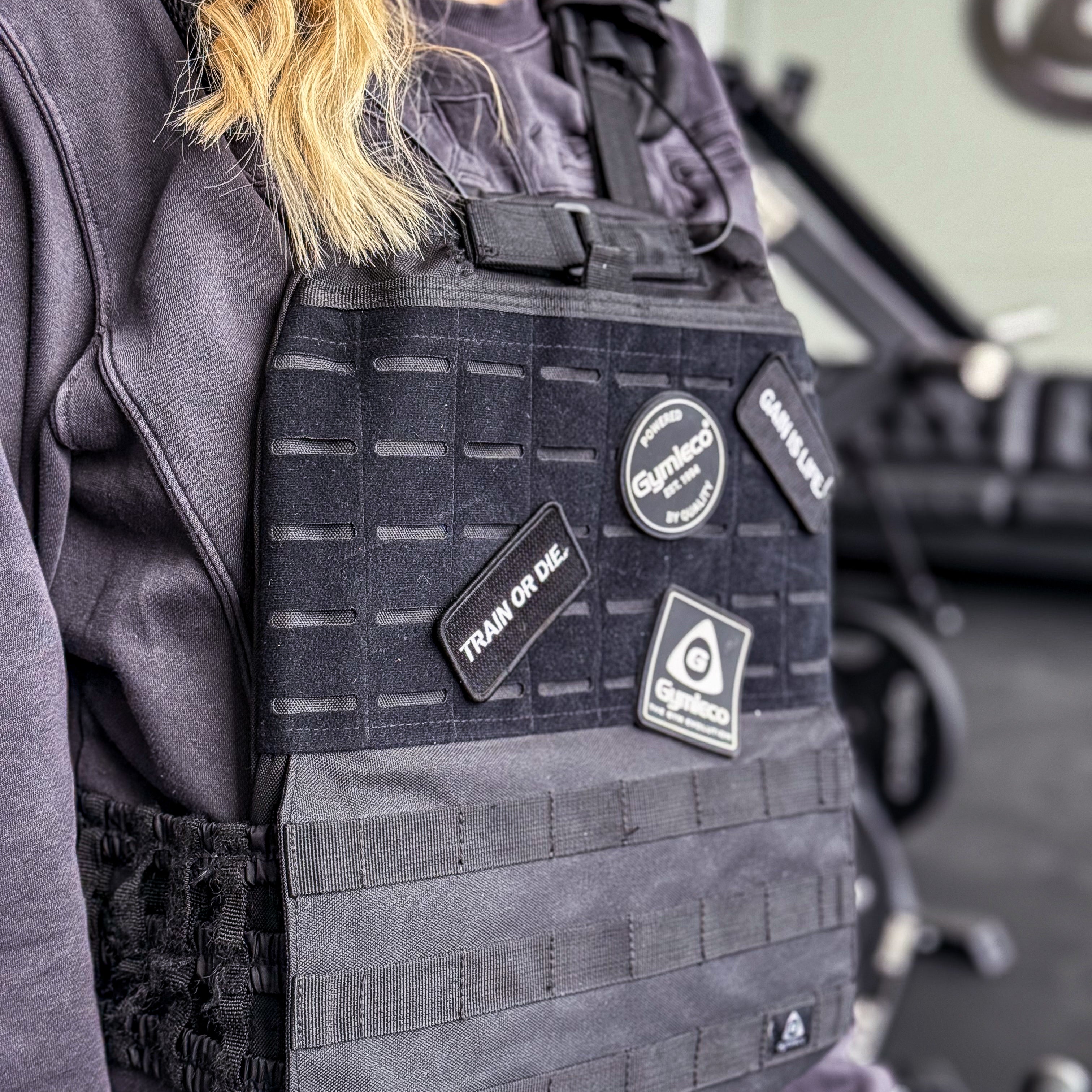 Weight vest with patches on.