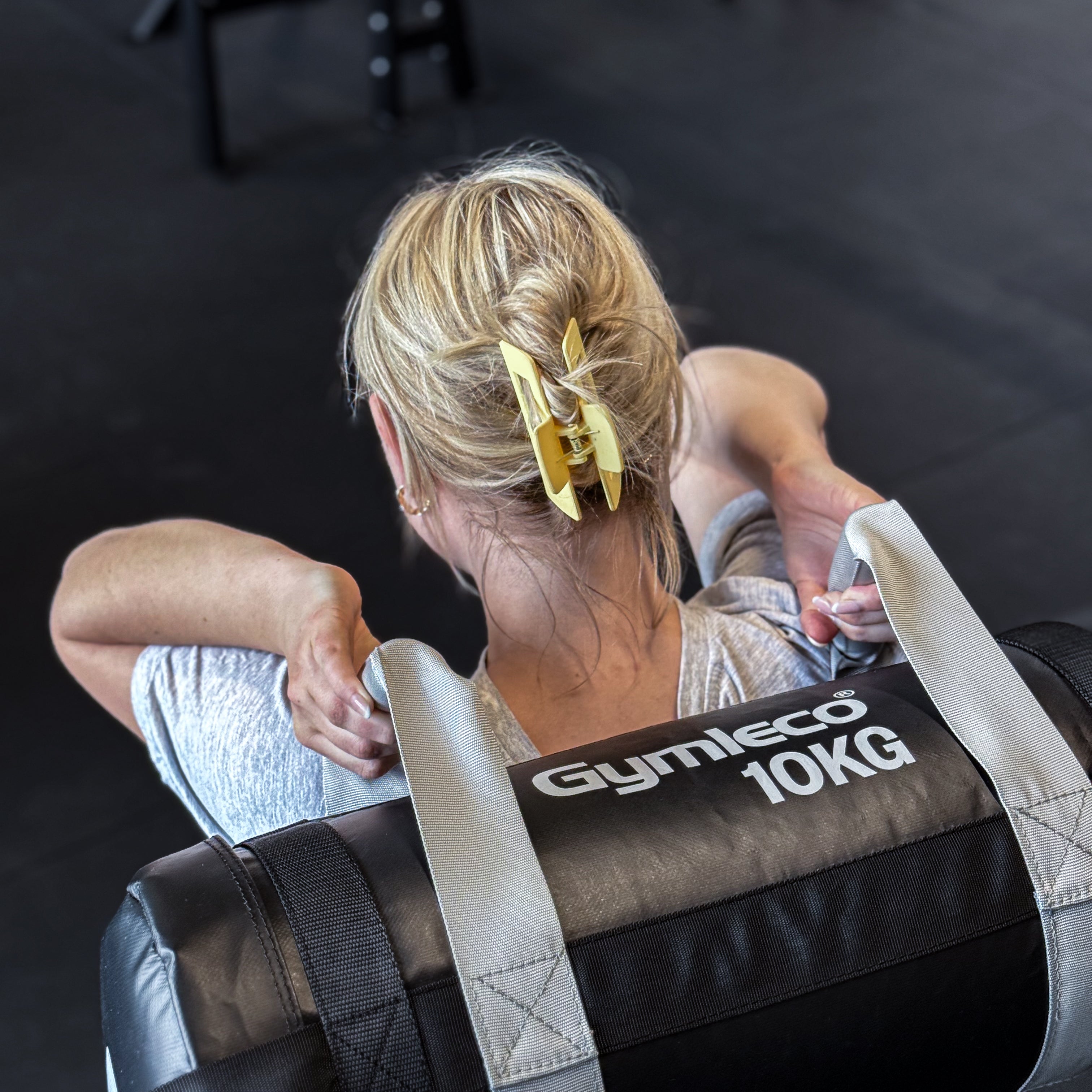 Gymleco Sandbag being used by a woman, picture taken from above