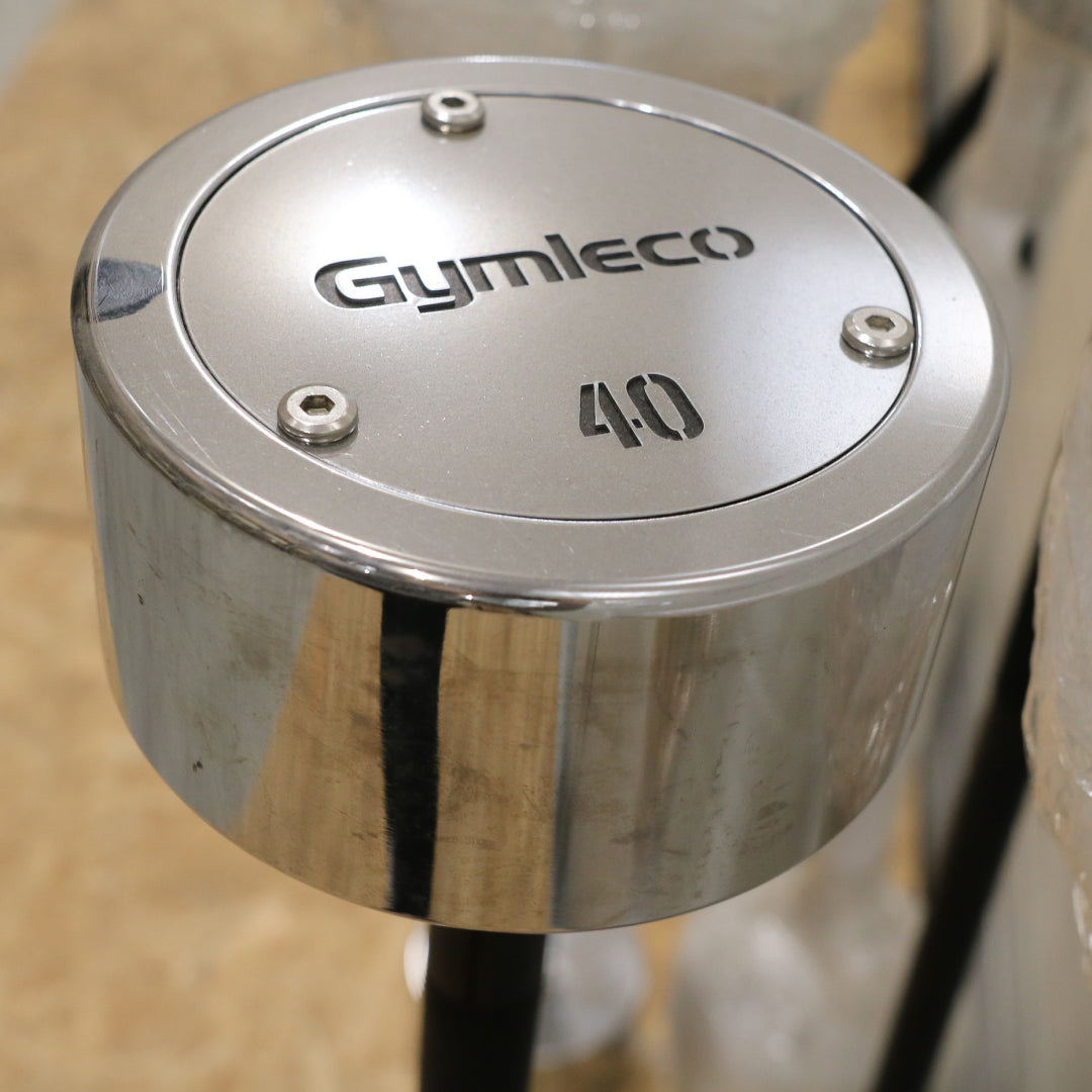 Metallic barbell with 'Gymleco' branding and number '40' on a blurred background