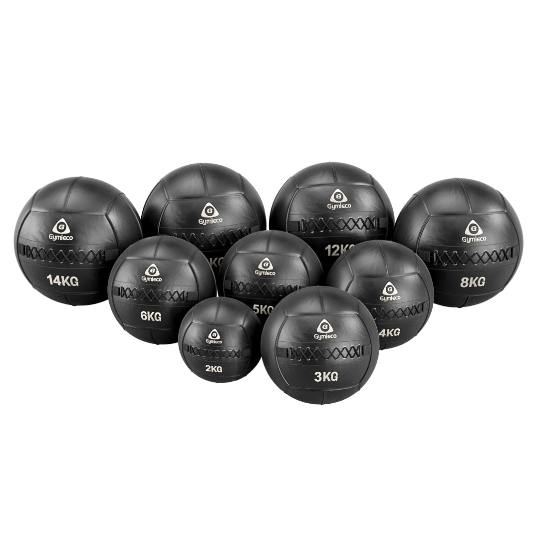A group of Wallballs with their weights and Gymleco logo on the front. White background 