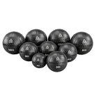 A group of Wallballs with their weights and Gymleco logo on the front. White background 