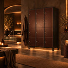 A 9-door wooden storage cabinet with a dark brown wood grain finish and silver handles, set in a modern spa-like interior with warm ambient lighting.